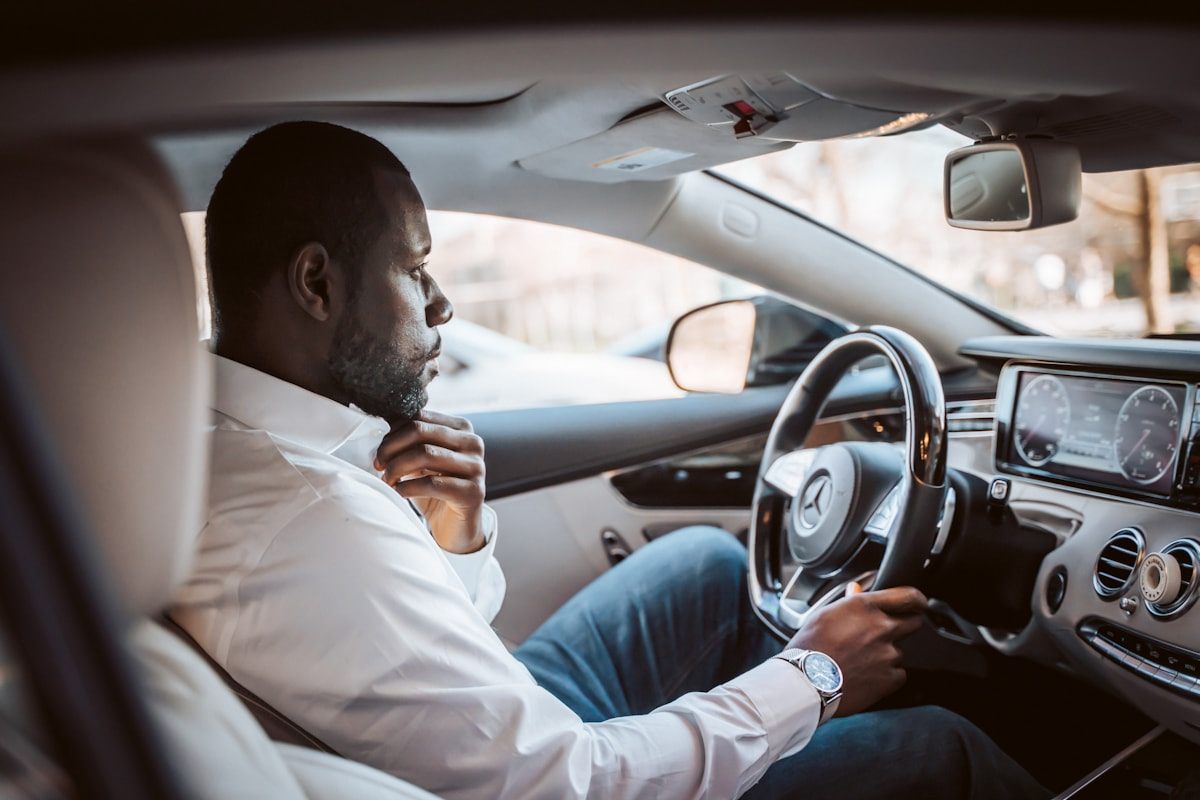 Owner at the wheel of his newly delivered car