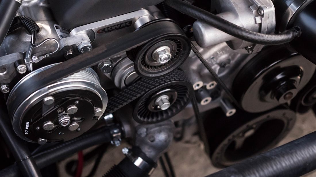 Close-up of an engine bay during inspection